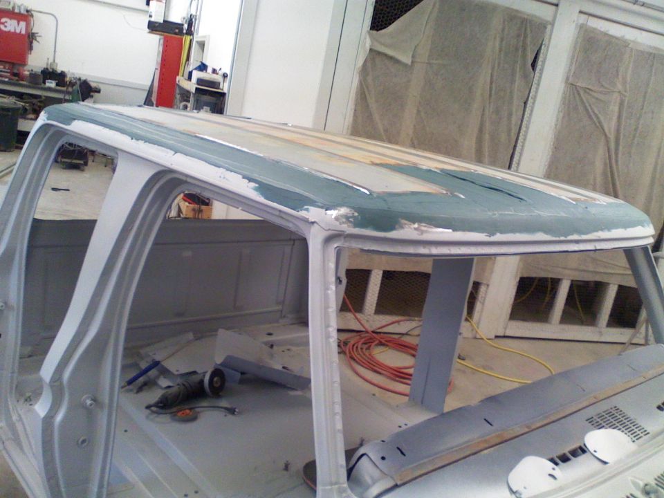 1979 Ford F-250 cab roof undergoing bodywork, primer and filler visible