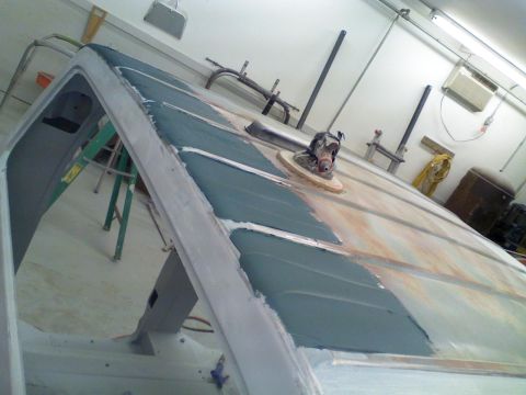 1979 Ford F-250 - The roof of a 1979 Ford F-250 is being prepped for paint, showing body filler and sanding marks.