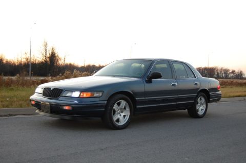 1985 Mercury Grand Marquis - This dark blue sedan is a 1995 Mercury Grand Marquis, not a 1985 model as claimed.