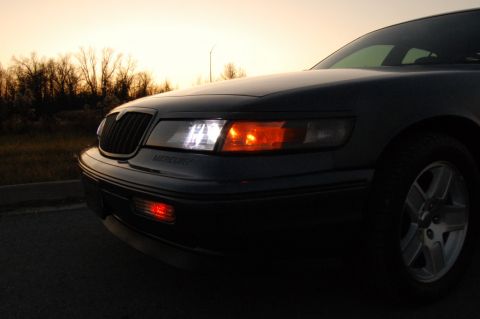 1985 Mercury Grand Marquis - A Mercury Grand Marquis is shown from the front quarter angle at dusk.
