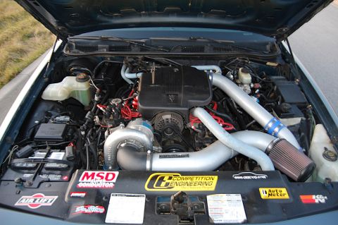 1985 Mercury Grand Marquis - The engine bay features a turbocharger and aftermarket performance parts, suggesting significant modifications.