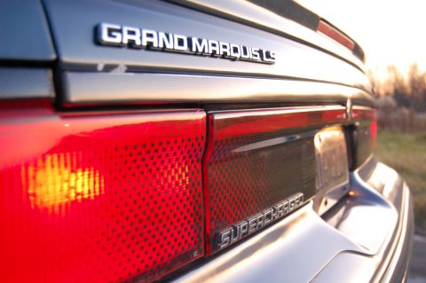 1985 Mercury Grand Marquis - Close-up of the rear of a Mercury Grand Marquis LS, highlighting the 'Supercharged' emblem.