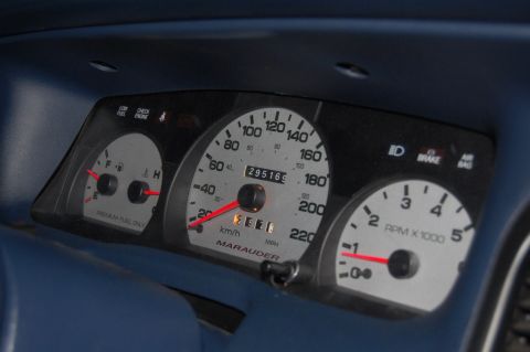 1985 Mercury Grand Marquis - The dashboard shows a speedometer, tachometer, and fuel gauge, with 'MARAUDER' visible on the speedometer.