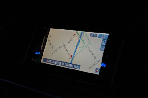 1985 Mercury Grand Marquis - A car's navigation screen shows a map with various street names and a time of 05:18.