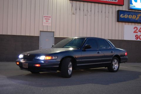 1985 Mercury Grand Marquis - This dark blue sedan is a 1995 Mercury Grand Marquis, identified by its body style.