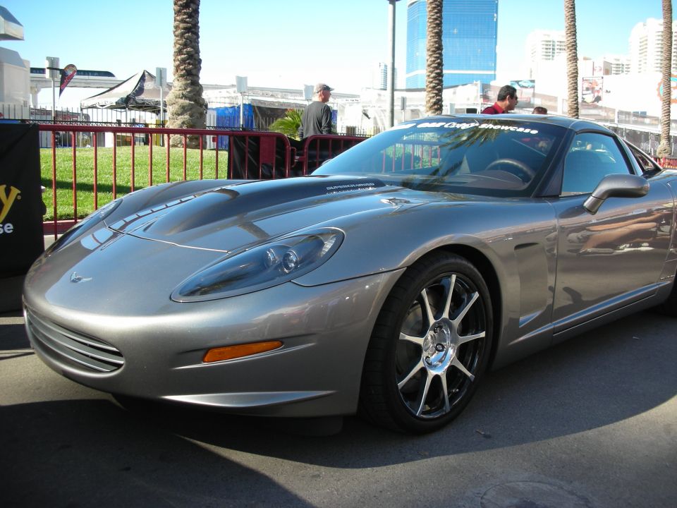 Gray Corvette C6 with aftermarket wheels and hood scoop