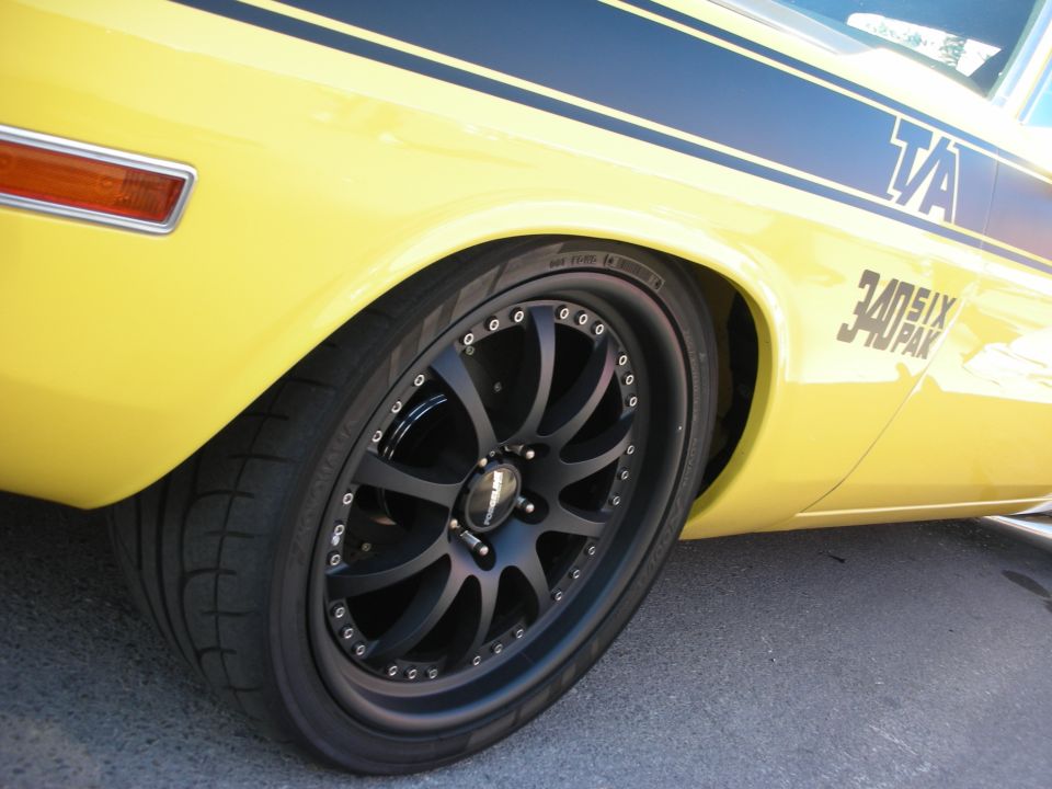 yellow muscle car side view, black stripes, TA and 340 SIX PAK decals, black aftermarket wheels