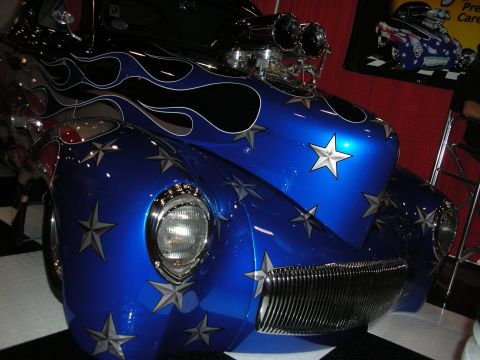 1998 Ford Crown Victoria - This custom hot rod features a patriotic star and flame paint scheme with a large blower scoop visible.