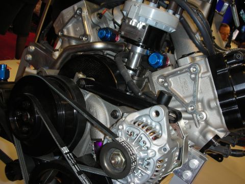 1998 Ford Crown Victoria - Detailed view of a Ford engine, highlighting the alternator and serpentine belt system.