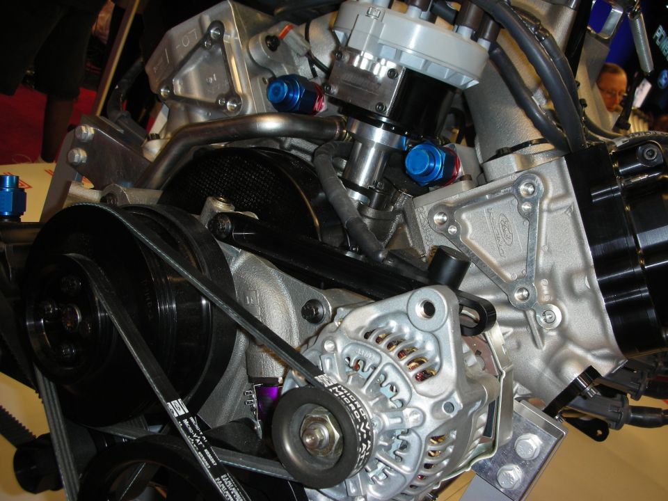 Close-up of a Ford engine with alternator and belts