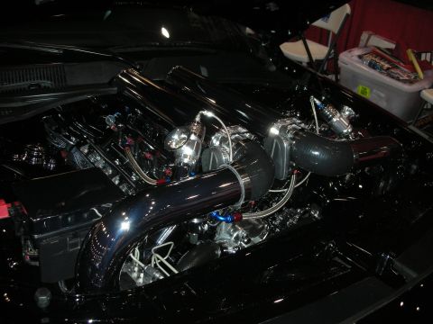 1998 Ford Crown Victoria - The engine bay features a custom setup with polished chrome intake piping and various engine components.
