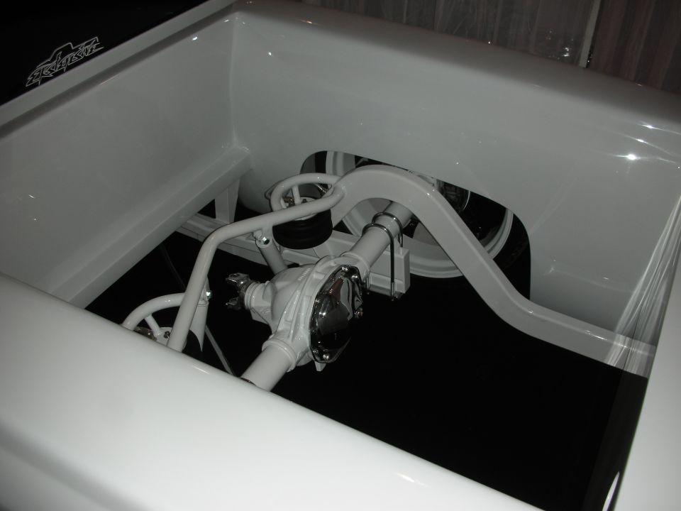 White custom pickup truck rear suspension with polished differential