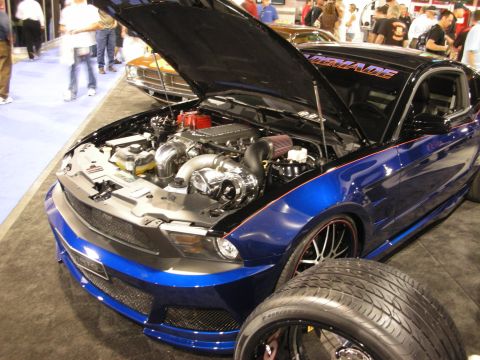 1998 Ford Crown Victoria - Customized Ford Mustang with twin turbo engine and "MADEMADE" decal on the windshield.