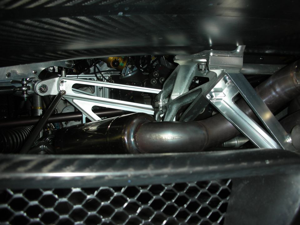 Close-up of car's underbody suspension and exhaust system