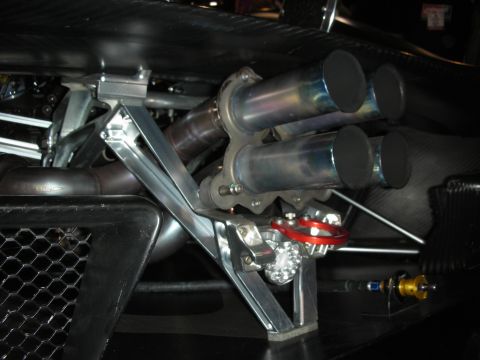 1998 Ford Crown Victoria - Custom quad exhaust tips and suspension components are visible in this close-up shot.