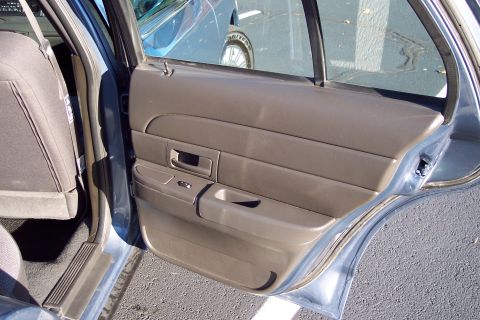 2001 Ford Crown Victoria - Rear door panel and seat of a 2001 Ford Crown Victoria.