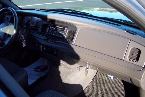 2001 Ford Crown Victoria - Interior view of a 2001 Ford Crown Victoria, showing the dashboard, steering wheel, and center console.