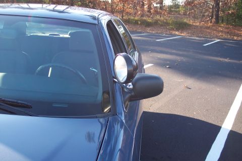 2001 Ford Crown Victoria - The 2001 Ford Crown Victoria is seen from the front quarter angle in a parking lot.