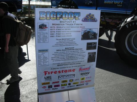 1998 Ford Crown Victoria - A display board details the history of Bigfoot Monster Truck #1 and its 35th Anniversary Edition.