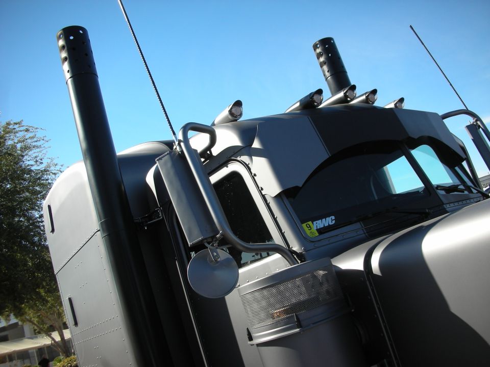 Semi-truck with large exhaust stacks and custom paint