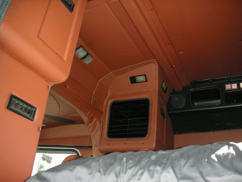 1998 Ford Crown Victoria - Interior view of a truck sleeper compartment, showing upholstery and bedding.