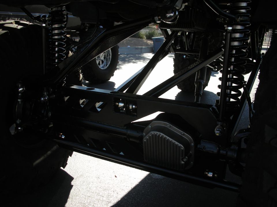 Custom suspension and differential with chrome wheels visible