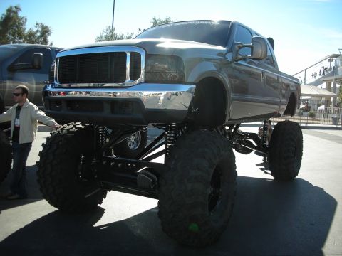 1998 Ford Crown Victoria - This heavily modified pickup truck features an extreme lift kit and oversized off-road tires.