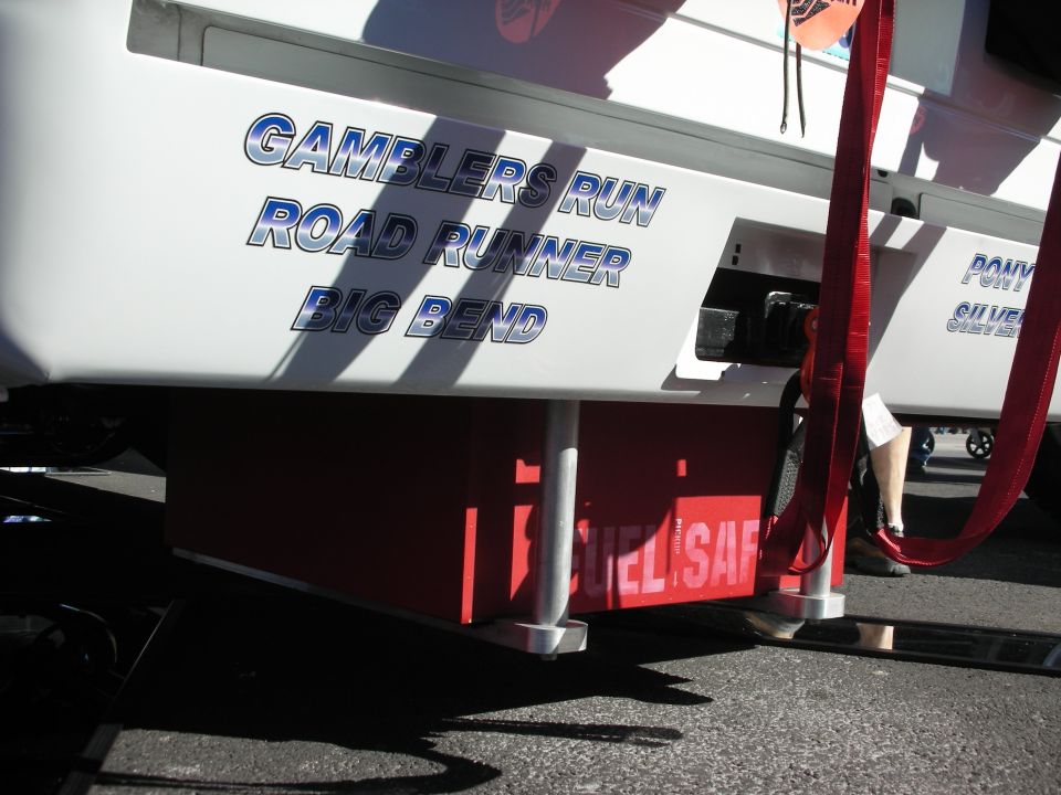 White vehicle side with blue text 'GAMBLERS RUN ROAD RUNNER BIG BEND' and red 'FUEL SAFE' box