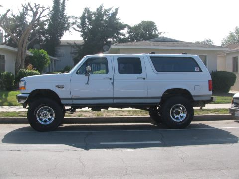 1996 Ford C-350 (Centurion Conversions) - This modified SUV features a lifted suspension and oversized tires, giving it a stance.