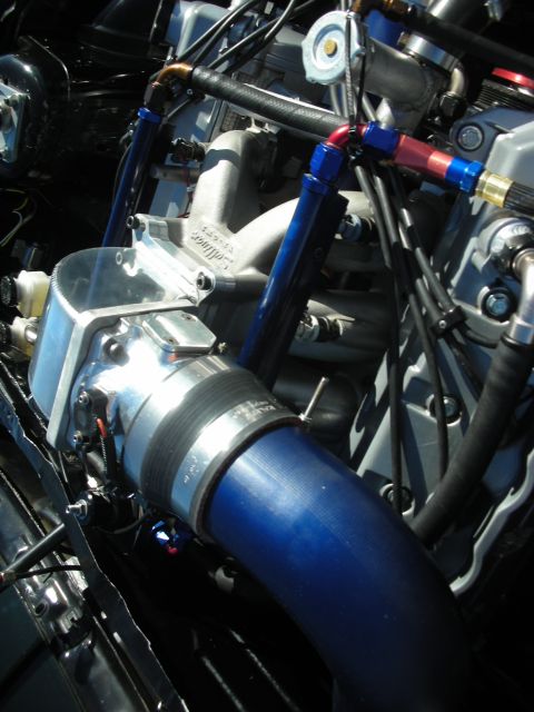 1998 Ford Crown Victoria - Custom engine modifications visible in the engine bay, a large intake hose and polished components.