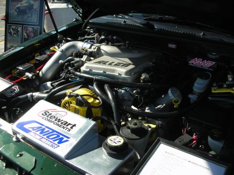 1998 Ford Crown Victoria - Custom engine bay with aftermarket parts, including a supercharger and various components.