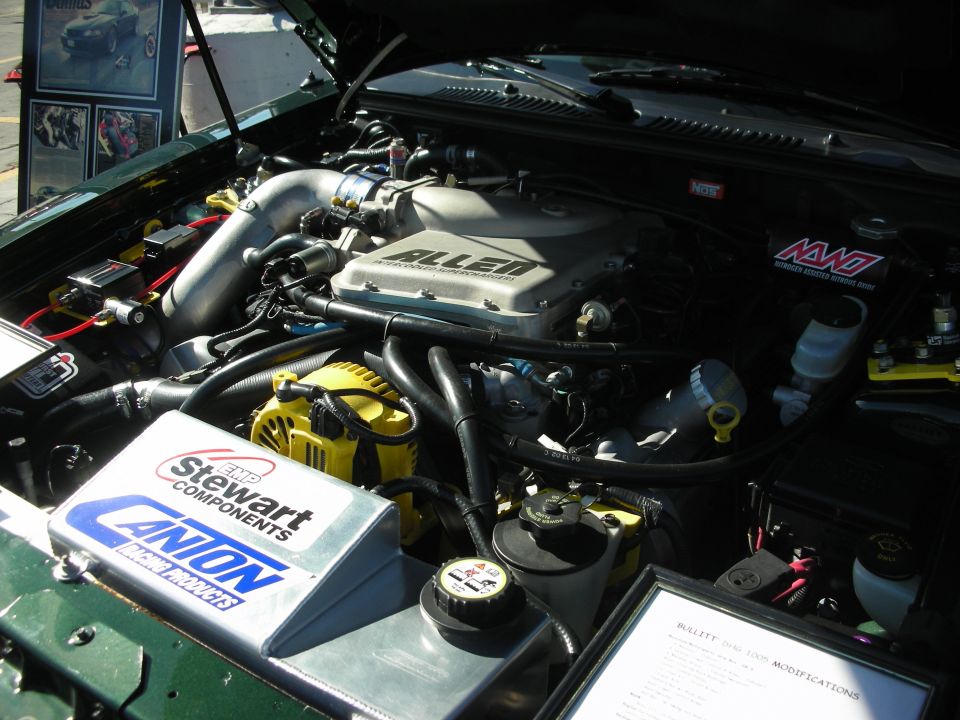 Engine bay with custom parts including an Allen supercharger and Stewart Components parts