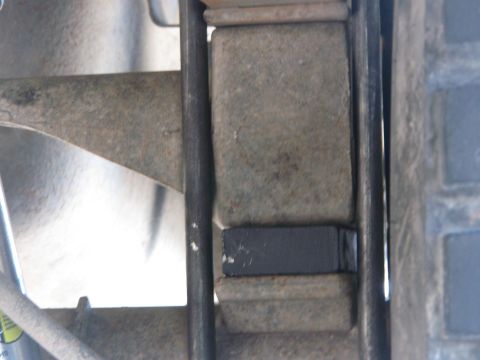 1996 Ford C-350 (Centurion Conversions) - Detail of a vehicle's suspension system, focusing on the leaf spring assembly.