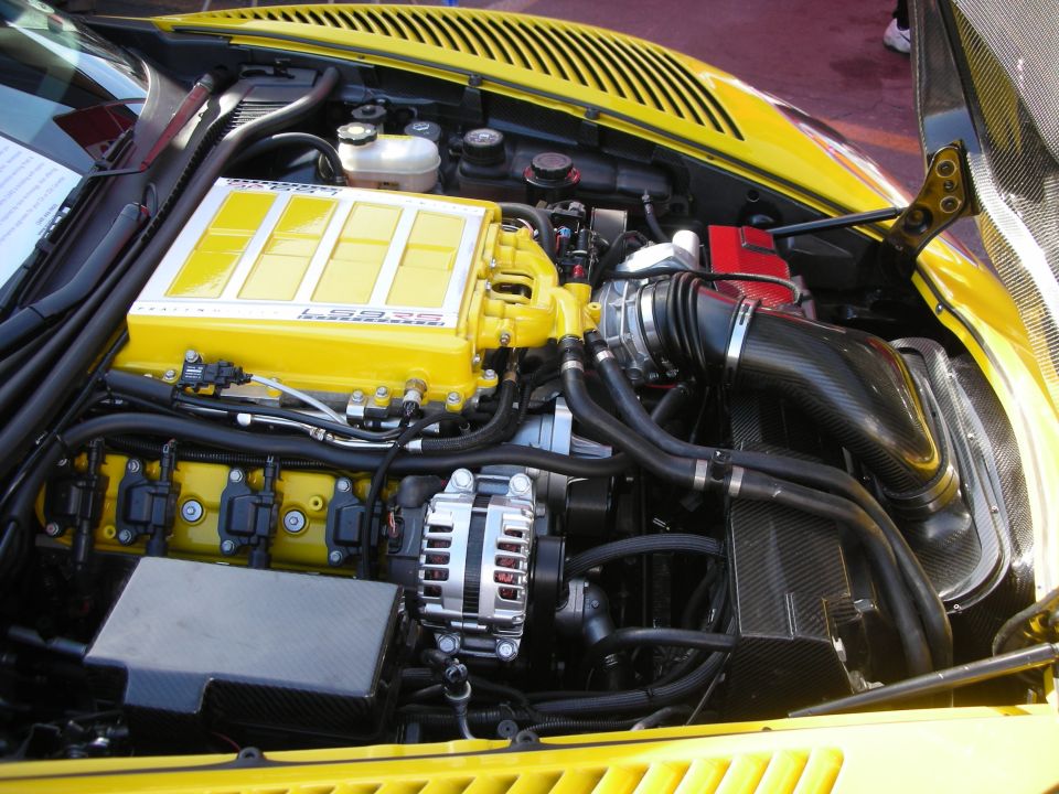 Yellow engine bay with a prominent yellow supercharger labeled 'LPE'