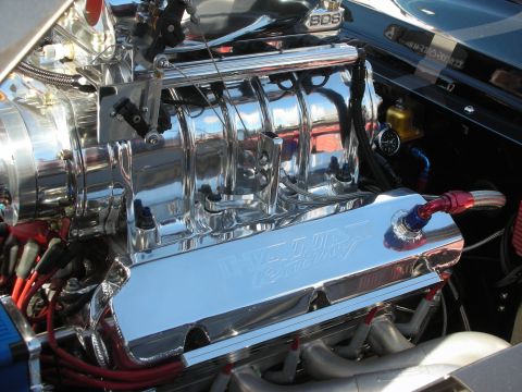 1998 Ford Crown Victoria - Close-up of a highly polished V8 engine, a BDS supercharger and custom valve covers.