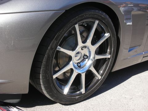 1998 Ford Crown Victoria - Close-up view of a custom wheel and fender on a gray vehicle.