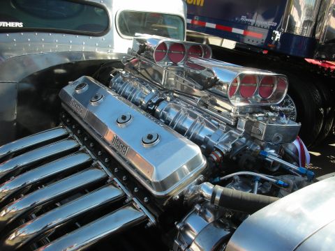 1998 Ford Crown Victoria - Close-up of a highly polished chrome engine dual carburetors and a valve cover clearly marked 'Diesel'.