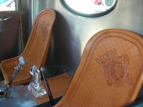 1998 Ford Crown Victoria - Interior view of custom tan leather seats with ornate embossed patterns.