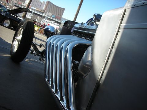 1998 Ford Crown Victoria - A custom hot rod is parked outdoors, with another vehicle in the background.