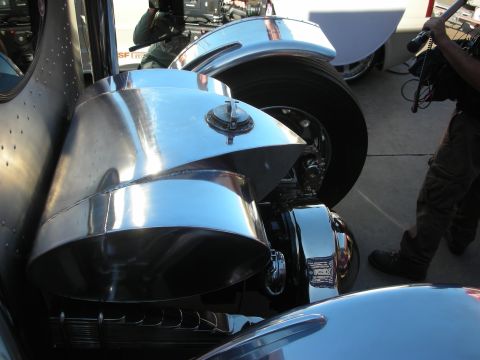 1998 Ford Crown Victoria - Close-up of a chrome air intake and wheel assembly on a vehicle.