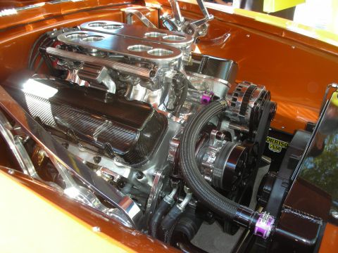 1998 Ford Crown Victoria - Close-up of a highly customized V8 engine, dual carburetors and polished components.