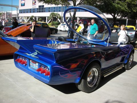 1998 Ford Crown Victoria - A heavily modified car with a unique bubble canopy and flame decals is displayed outdoors.
