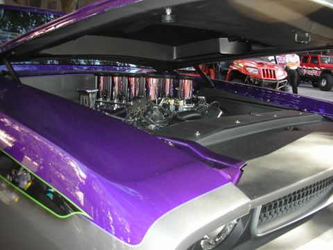 1998 Ford Crown Victoria - Customized car with hood open, revealing a chrome engine setup and other vehicles in the background.