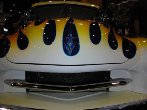 1998 Ford Crown Victoria - This customized hot rod features a striking flame paint job with a pinstripe detail on the hood.