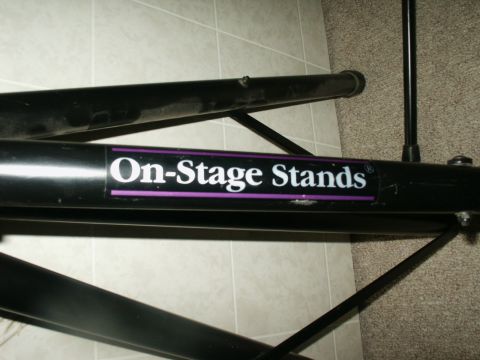 1990 Ford Bronco - Close-up of a black metal stand the "On-Stage Stands" logo.