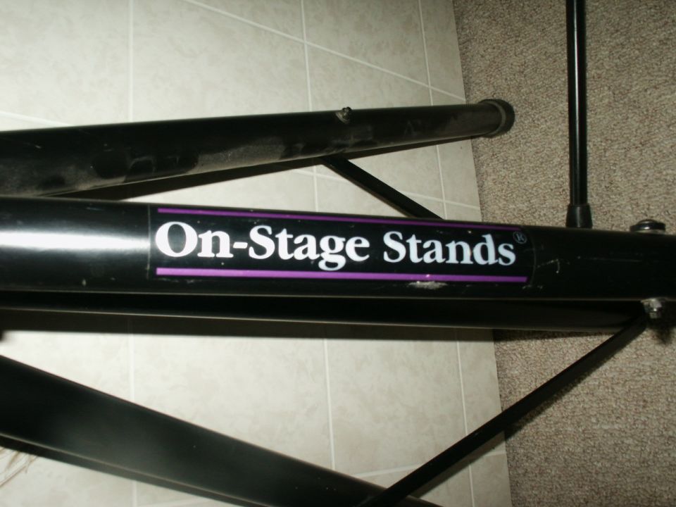 Black metal stand with "On-Stage Stands" logo