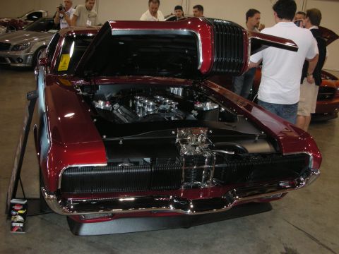 1998 Ford Crown Victoria - Customized classic car with exposed engine at a show, other vehicles visible in background.