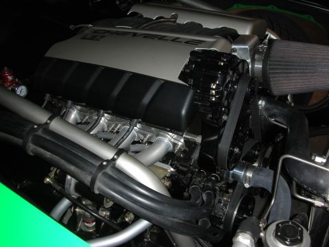 1998 Ford Crown Victoria - Close-up view of a powerful Chevelle LS7 engine, chrome exhaust and a prominent air intake system.