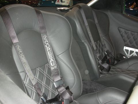 1998 Ford Crown Victoria - The interior features Corbeau racing seats with diamond stitching and multi-point harnesses.