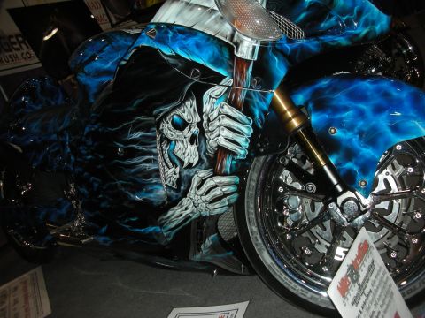 1998 Ford Crown Victoria - This custom motorcycle features striking grim reaper airbrush art with blue flame accents.